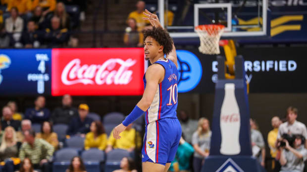 Jan 7, 2023; Morgantown, West Virginia, USA; Kansas Jayhawks forward Jalen Wilson (10) celebrates a three pointer during the first half against the West Virginia Mountaineers at WVU Coliseum.